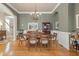 Formal dining room with chandelier, hardwood floors, and wainscoting at 4298 Kingston Gate Cv, Chamblee, GA 30341