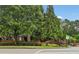 Community entrance featuring lush landscaping and brick signage, a warm welcome to residents and visitors at 4298 Kingston Gate Cv, Chamblee, GA 30341