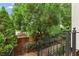 Inviting brick pathway with wrought iron railings leading to the entrance of the home at 4298 Kingston Gate Cv, Chamblee, GA 30341