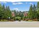 Exterior of gated community entrance with brick townhomes and beautiful landscaping at 4298 Kingston Gate Cv, Chamblee, GA 30341