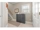 Inviting entryway with staircase, neutral colors, and closet at 4298 Kingston Gate Cv, Chamblee, GA 30341