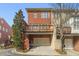 Charming multi-story townhome with brick facade, garage, and private balcony at 4298 Kingston Gate Cv, Chamblee, GA 30341