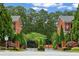 Upscale brick townhomes with lush landscaping and gated entrance at 4298 Kingston Gate Cv, Chamblee, GA 30341
