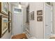 Bright foyer with hardwood floors, white door, elegant lighting, and beautiful wall decor at 4298 Kingston Gate Cv, Chamblee, GA 30341