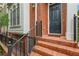 Brick steps lead to the front door with a black frame, and the house number '4298' displayed above at 4298 Kingston Gate Cv, Chamblee, GA 30341