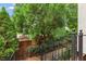 Landscaped front yard with brick retaining wall and stairs leading up to the front door at 4298 Kingston Gate Cv, Chamblee, GA 30341