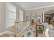 Upstairs hallway showcasing hardwood floors, neutral paint, and access to other areas of the home at 4298 Kingston Gate Cv, Chamblee, GA 30341