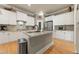 Charming kitchen features white cabinets, granite countertops and stainless steel appliances at 4298 Kingston Gate Cv, Chamblee, GA 30341