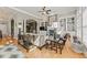 Open-concept living room featuring a fireplace, built-in shelving, and hardwood floors at 4298 Kingston Gate Cv, Chamblee, GA 30341
