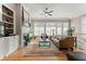 Spacious living room with fireplace, built-in shelves, and hardwood floors at 4298 Kingston Gate Cv, Chamblee, GA 30341