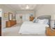 Spacious main bedroom with tray ceiling, neutral colors, and carpet flooring at 4298 Kingston Gate Cv, Chamblee, GA 30341