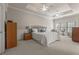 Calm main bedroom with tray ceilings, sitting area and large windows at 4298 Kingston Gate Cv, Chamblee, GA 30341