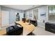 Office features a sleek desk and ample natural light and a peek into a storage closet at 4298 Kingston Gate Cv, Chamblee, GA 30341