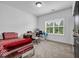 Comfortable bedroom with natural light, desk area, and neutral carpeting at 4565 Sims Park Ovlk, Suwanee, GA 30024