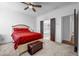 Spacious bedroom with ensuite bathroom, a ceiling fan, and neutral-toned walls at 4565 Sims Park Ovlk, Suwanee, GA 30024