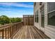 A spacious wooden deck with railing offers outdoor living space, with views and privacy lattice at 4565 Sims Park Ovlk, Suwanee, GA 30024