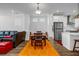 Open concept dining area blending seamlessly with the living room and featuring modern decor at 4565 Sims Park Ovlk, Suwanee, GA 30024