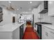 Modern kitchen featuring white cabinets, stainless steel appliances, and an open layout at 4565 Sims Park Ovlk, Suwanee, GA 30024