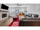 Bright living room with stone fireplace, hardwood floors, and modern decor accents at 4565 Sims Park Ovlk, Suwanee, GA 30024