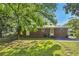 The backyard is shaded with mature trees at 7577 Haley Dr, Jonesboro, GA 30236