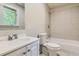 Updated bathroom featuring a white sink, toilet, and tile tub-shower combo at 7577 Haley Dr, Jonesboro, GA 30236