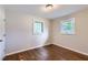 Bedroom with hardwood floors, neutral walls, and windows providing natural light at 7577 Haley Dr, Jonesboro, GA 30236