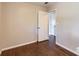 Bedroom featuring hardwood floors, neutral walls and open door at 7577 Haley Dr, Jonesboro, GA 30236