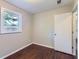 Bedroom featuring hardwood floors, neutral walls and window views at 7577 Haley Dr, Jonesboro, GA 30236