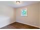 Bedroom with hardwood floors, neutral walls, and natural light from window at 7577 Haley Dr, Jonesboro, GA 30236