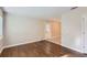 Bright living room featuring hardwood floors and a neutral color palette for versatile styling options at 7577 Haley Dr, Jonesboro, GA 30236