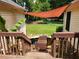 Unique backyard with a small pond, wooden bridge, and partial shade at 350 Lakeview Dr, Brooks, GA 30205