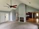 Open living space featuring a fireplace and hardwood floors, with views into the kitchen at 350 Lakeview Dr, Brooks, GA 30205