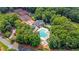 Aerial view of community amenities including pool, clubhouse, playground, and tennis courts surrounded by lush trees at 4305 Chesapeake Trce, Acworth, GA 30101