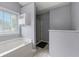 Bathroom featuring soaking tub, shower and bright window at 4305 Chesapeake Trce, Acworth, GA 30101
