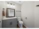 Cozy half bathroom with gray vanity and modern fixtures at 4305 Chesapeake Trce, Acworth, GA 30101