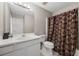 Bathroom with a single sink vanity and shower with a patterned curtain at 4305 Chesapeake Trce, Acworth, GA 30101
