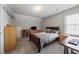 Cozy bedroom featuring a bed, dresser, and workspace, creating a comfortable and functional living space at 4305 Chesapeake Trce, Acworth, GA 30101