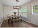 Bright dining area featuring a wooden table and bench with modern light fixture at 4305 Chesapeake Trce, Acworth, GA 30101