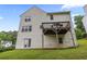 Back exterior of home with siding and wooden deck overlooking the spacious yard, perfect for outdoor enjoyment at 4305 Chesapeake Trce, Acworth, GA 30101