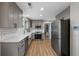 Spacious kitchen featuring stainless steel appliances, modern cabinetry, and hardwood flooring at 4305 Chesapeake Trce, Acworth, GA 30101