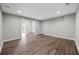 Bright living room with hardwood floors and a doorway leading to the outdoors, perfect for relaxation and entertainment at 4305 Chesapeake Trce, Acworth, GA 30101