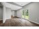 Living area with hardwood floors, neutral paint, and access to the backyard through French doors for indoor-outdoor living at 4305 Chesapeake Trce, Acworth, GA 30101
