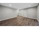 Spacious living room featuring hardwood flooring, neutral walls, and a closet, offering a versatile living space at 4305 Chesapeake Trce, Acworth, GA 30101