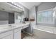 Bright main bathroom featuring soaking tub, vanity and linen closet at 4305 Chesapeake Trce, Acworth, GA 30101