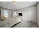 Spacious main bedroom with plush carpet, tray ceiling, and bright windows at 4305 Chesapeake Trce, Acworth, GA 30101