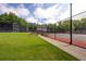 Beautiful community tennis courts with manicured landscaping, benches, and trees at 4305 Chesapeake Trce, Acworth, GA 30101