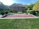 View of the house from the backyard, showcasing the patio and extensive tiered landscaping at 45 Mountain Crest Dr, Oxford, GA 30054