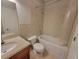 Bathroom featuring a tiled shower-tub combo, toilet, and vanity with granite countertop at 45 Mountain Crest Dr, Oxford, GA 30054