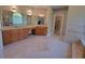 Spacious bathroom with and wooden vanities and decorative tile flooring, creating a luxurious retreat at 45 Mountain Crest Dr, Oxford, GA 30054