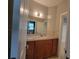 Bathroom with granite countertops, wood cabinets and neutral tile backsplash at 45 Mountain Crest Dr, Oxford, GA 30054